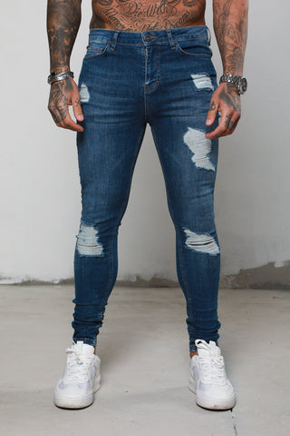 Surreal Ripped and Repaired Blue Jeans